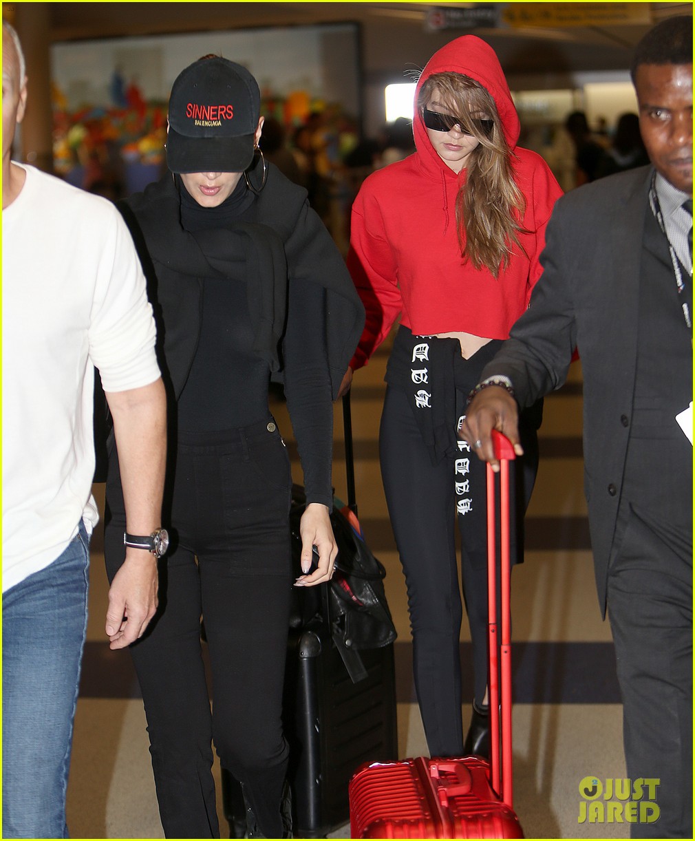 gigi and bella hadid coordinate their looks while arriving back in nyc 02