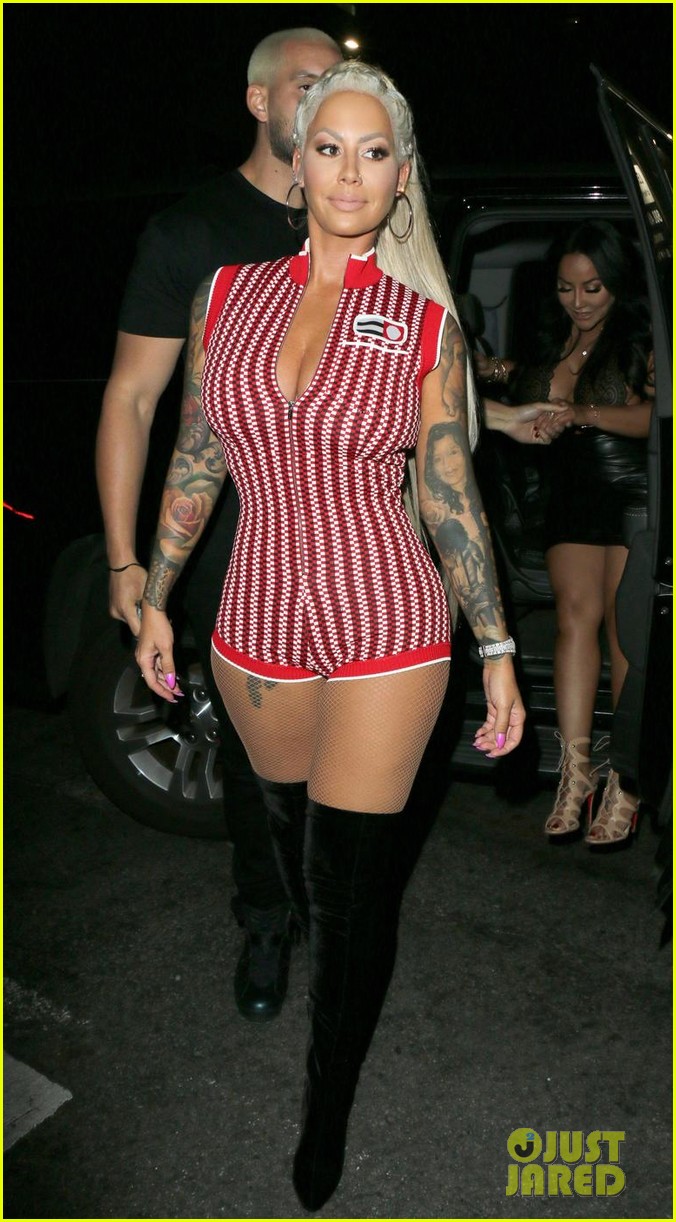 amber rose shows off her long blonde hair and curves at the club 02