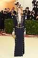 emma stone stuns in plunging navy and gold gown at met gala 2018 01