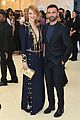 emma stone stuns in plunging navy and gold gown at met gala 2018 03