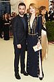 emma stone stuns in plunging navy and gold gown at met gala 2018 04