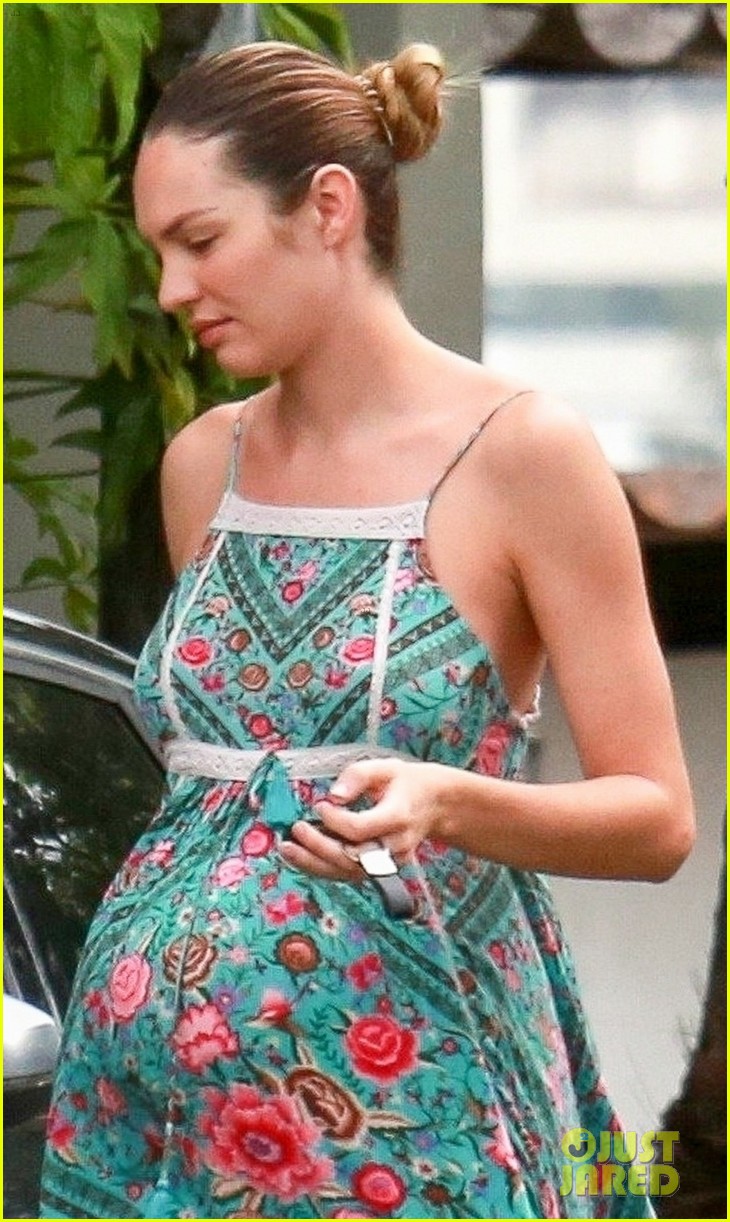 pregnant candice swanepoel covers baby bump in summer dress 024082887