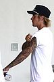 justin bieber shows off his tattoo sleeves while arriving at miami hotel 04