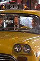 keanu reeves stops a cab in rain john wick 3 07