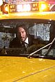 keanu reeves stops a cab in rain john wick 3 08