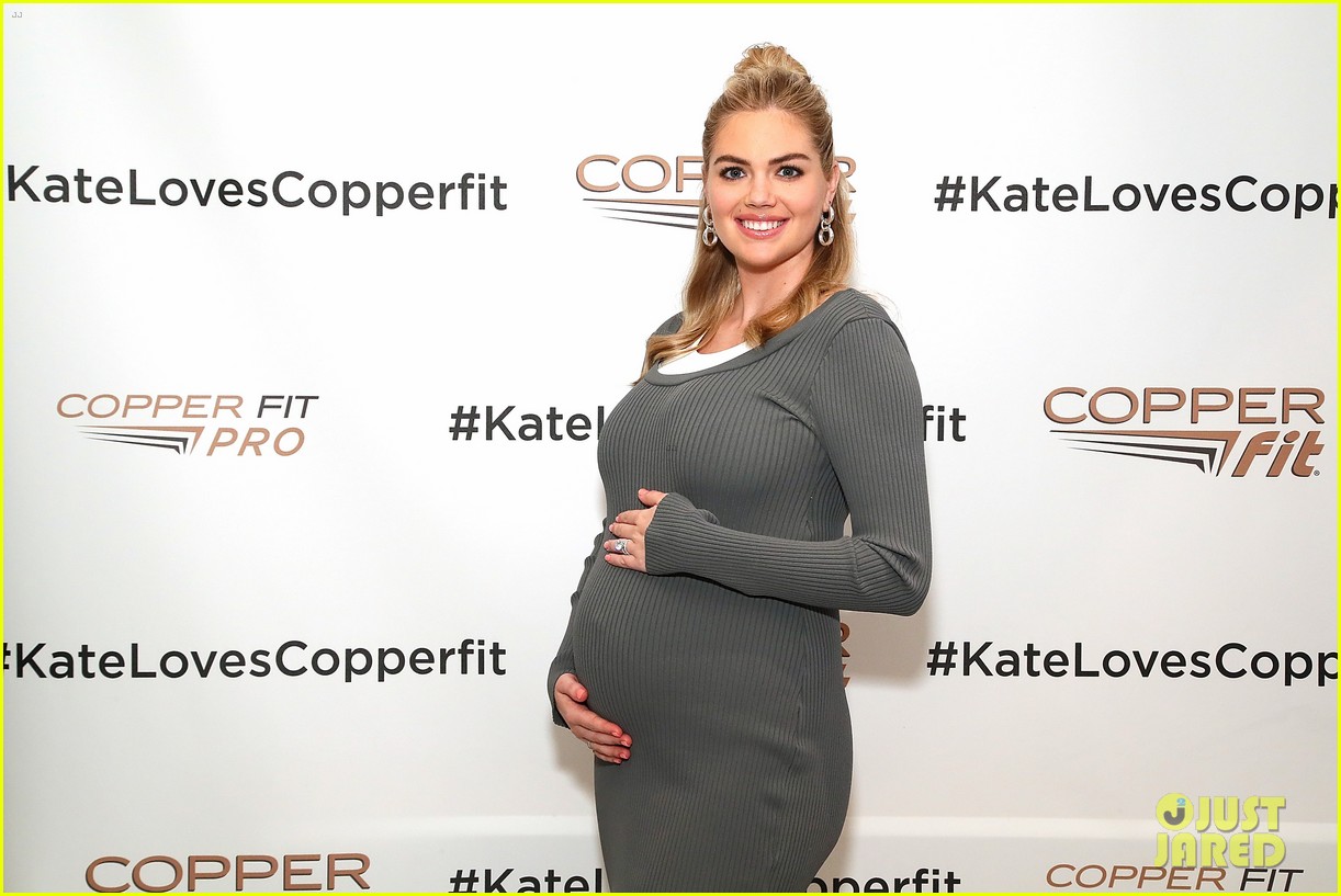 kate upton cradles baby bump athletic wear launch in nyc 02