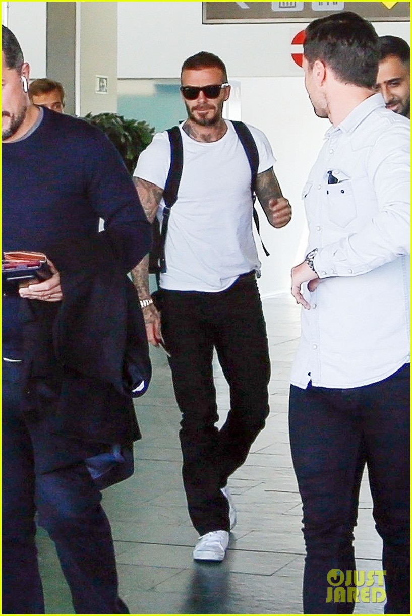 david beckham puts his tattoos on display while arriving in barcelona034159430