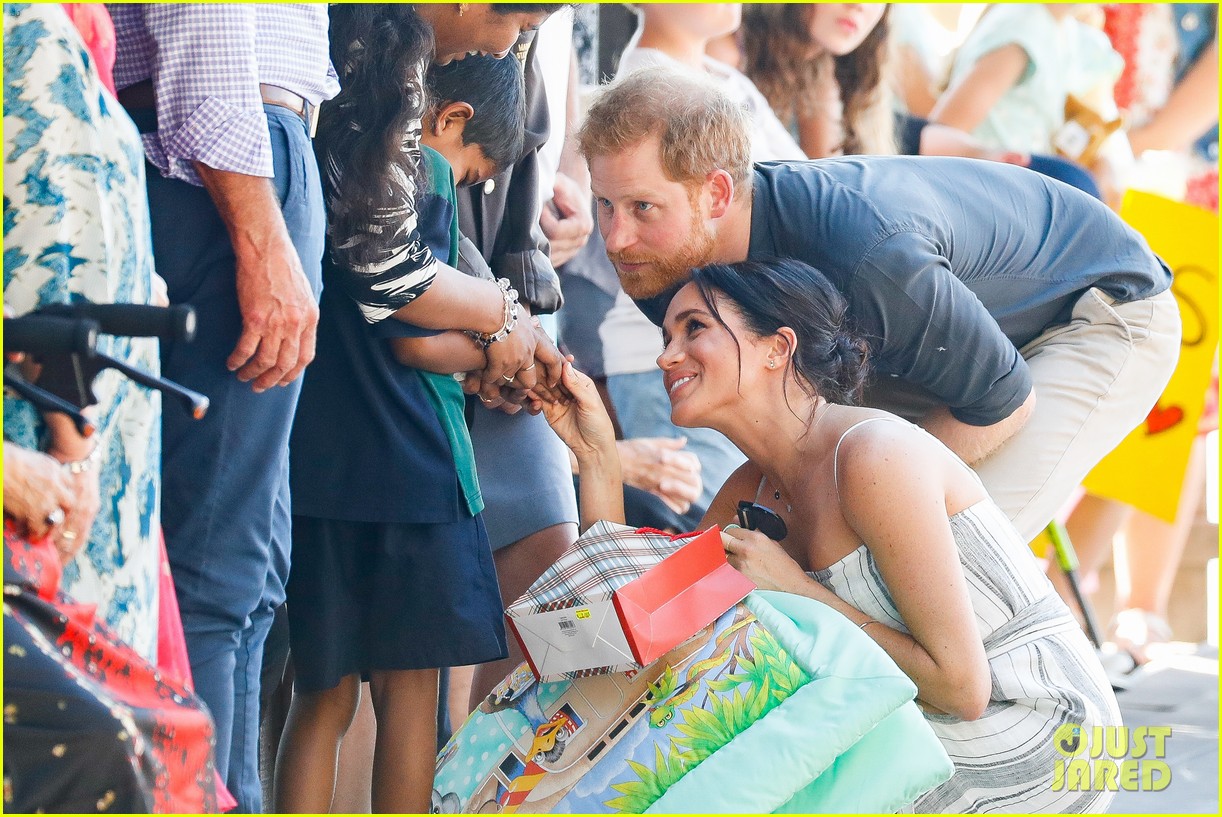 Pregnant Meghan Markle Cradles Tiny Baby Bump on Australia's Fraser