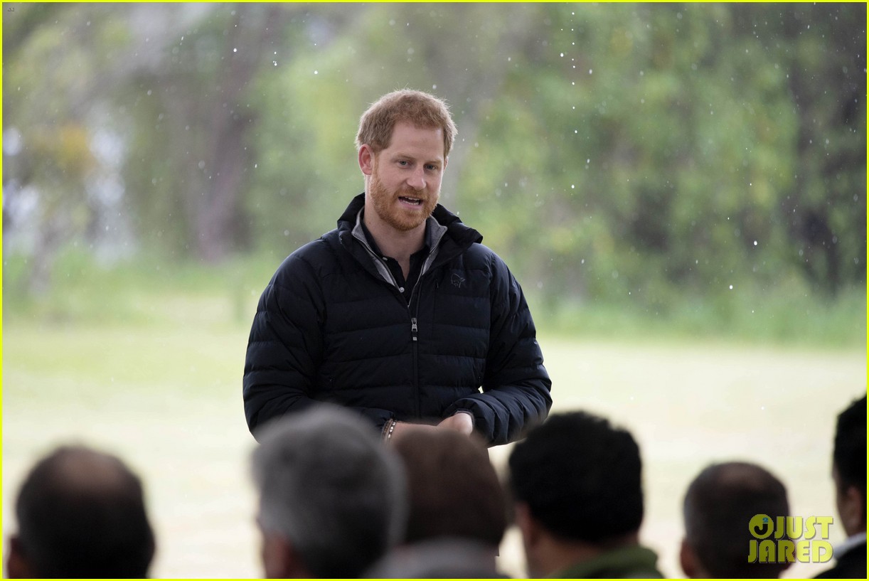 Duchess Meghan Markle & Prince Harry Brave the Rainy Weather for New