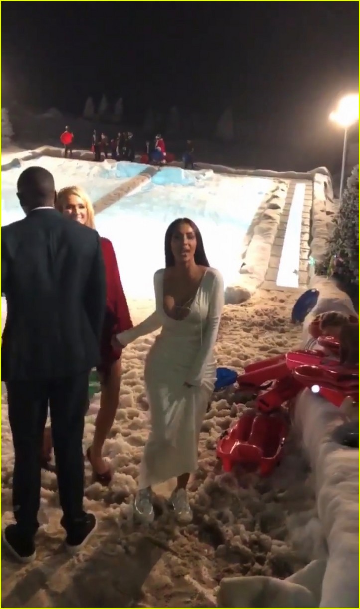 Kim Kardashian Goes Sledding in Her Gown with Paris Hilton at Christmas
