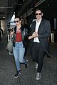milla jovovich at airport with husband 01