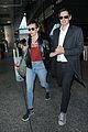 milla jovovich at airport with husband 03