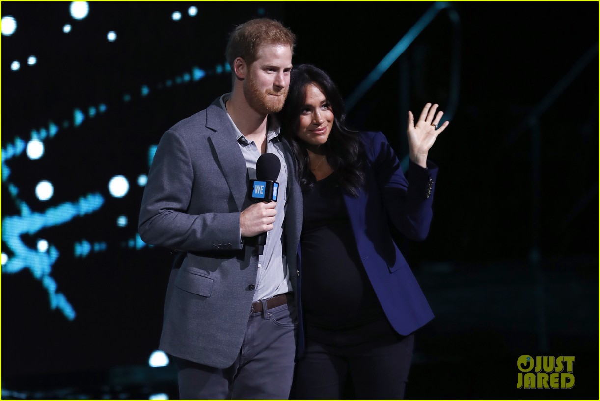 prince harry drags duchess meghan markle on stage we day 05