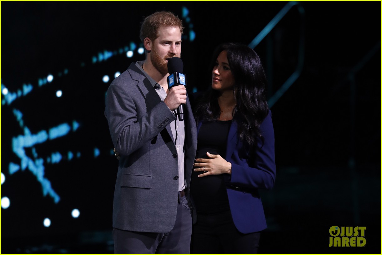 prince harry drags duchess meghan markle on stage we day 13