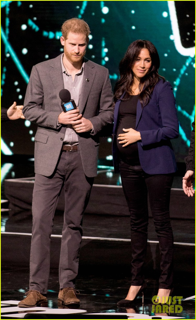 prince harry drags duchess meghan markle on stage we day 214252472
