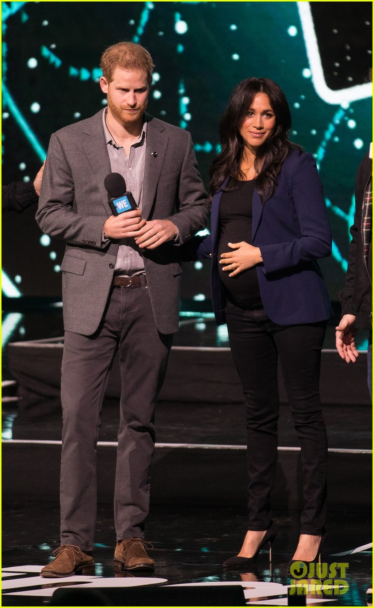 prince harry drags duchess meghan markle on stage we day 244252475