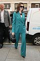 anne hathaway puts fun spin on traditional suit look 15