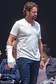 gerard butler wears a cast while filming greenland 04