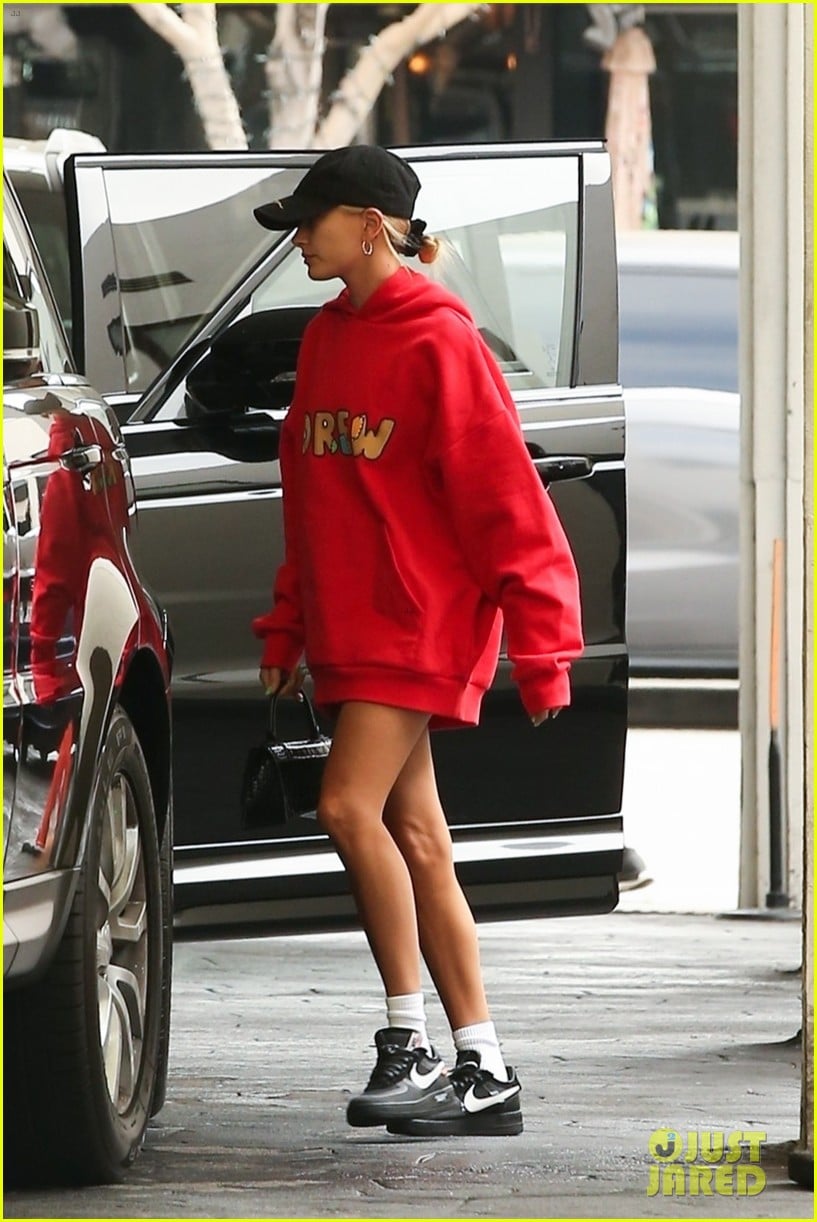 justin and hailey bieber pop in red outfits while running errands 034338987