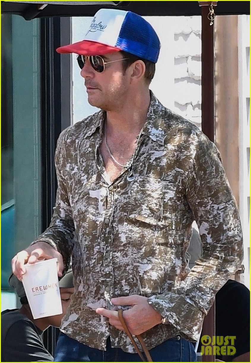 dylan mcdermott grabs a cool treat while walking his dog 02