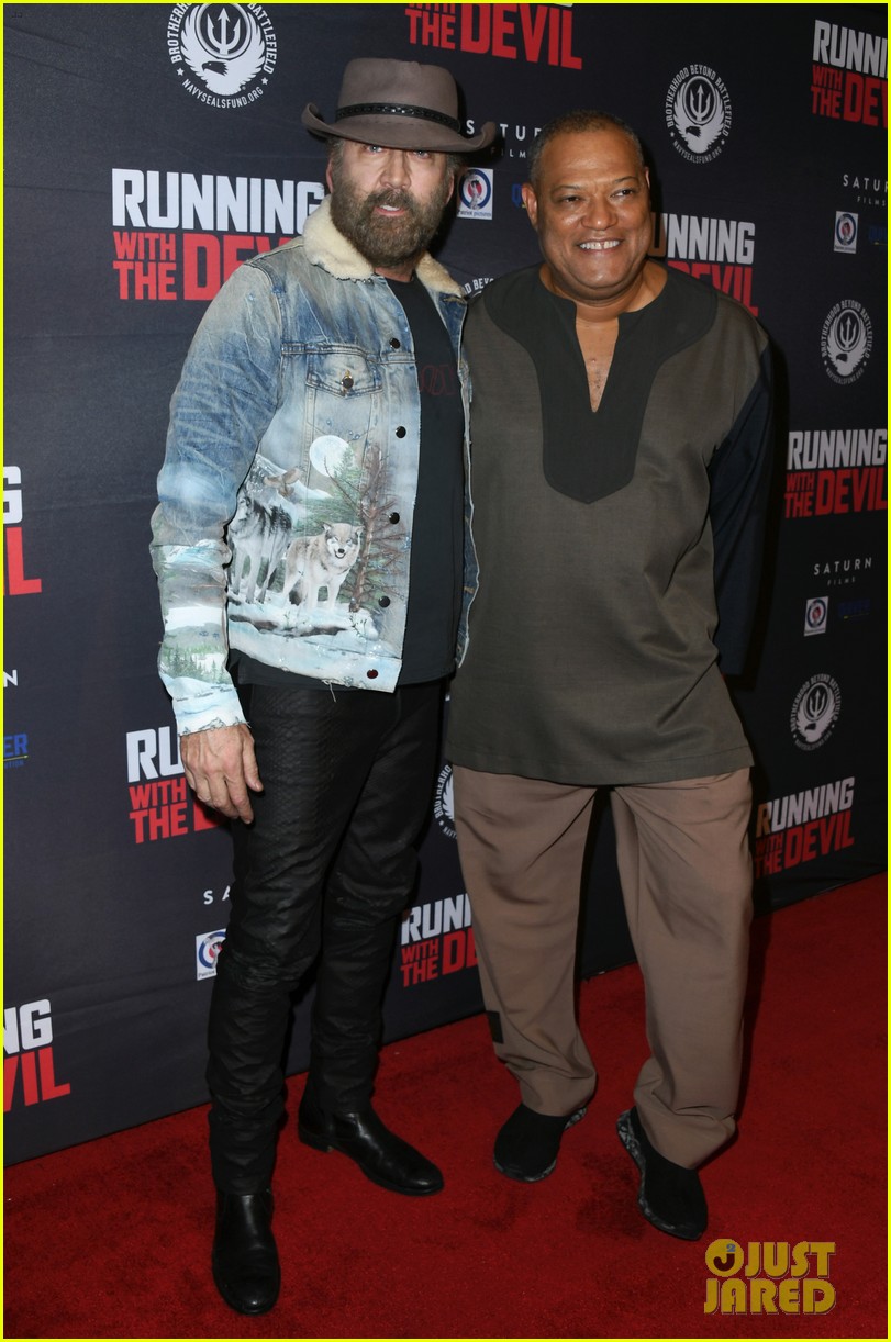 nicolas cage gets support son weston at running with the devil premiere 01