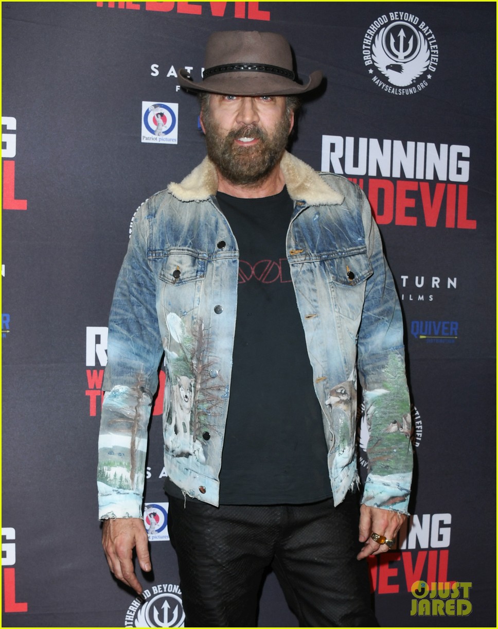 nicolas cage gets support son weston at running with the devil premiere 24