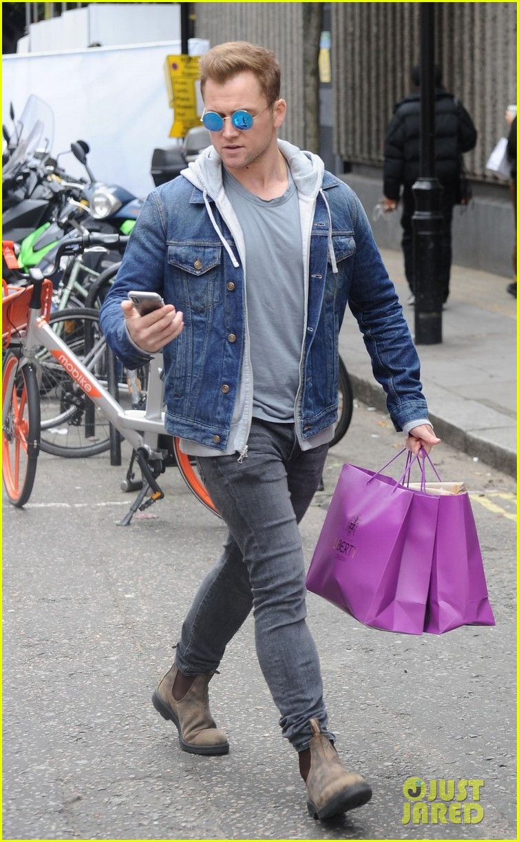 taron egerton dons denim jacket and hoodie while out in london 01