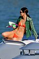 kendall jenner wears tiny orange bikini reading on boat 02