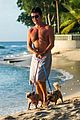 simon cowell shirtless dog walk barbados beach 01