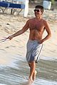 simon cowell shirtless dog walk barbados beach 02