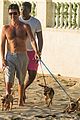 simon cowell shirtless dog walk barbados beach 04