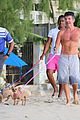 simon cowell shirtless dog walk barbados beach 06