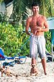 simon cowell shirtless dog walk barbados beach 07