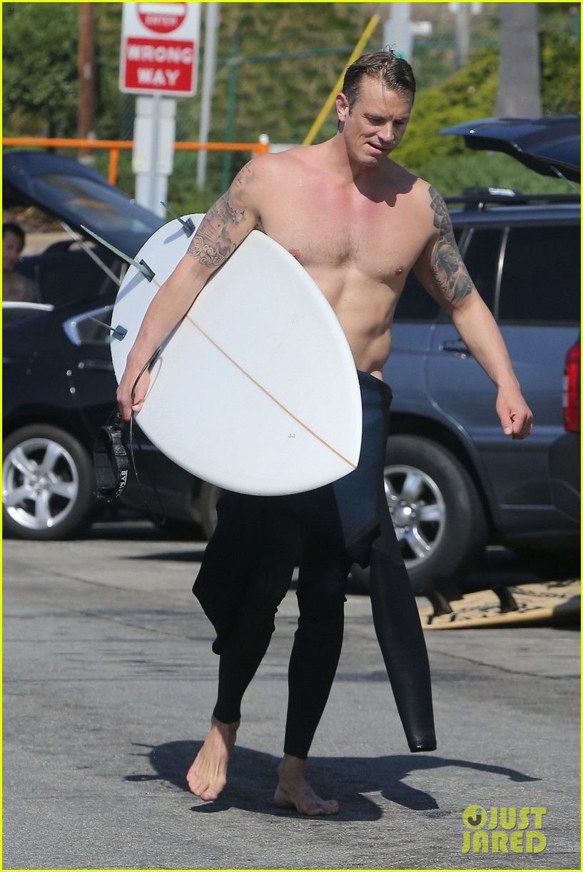 joel kinnaman shirtless surfing at beach 114439891