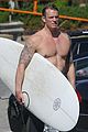 joel kinnaman shirtless surfing at beach 24
