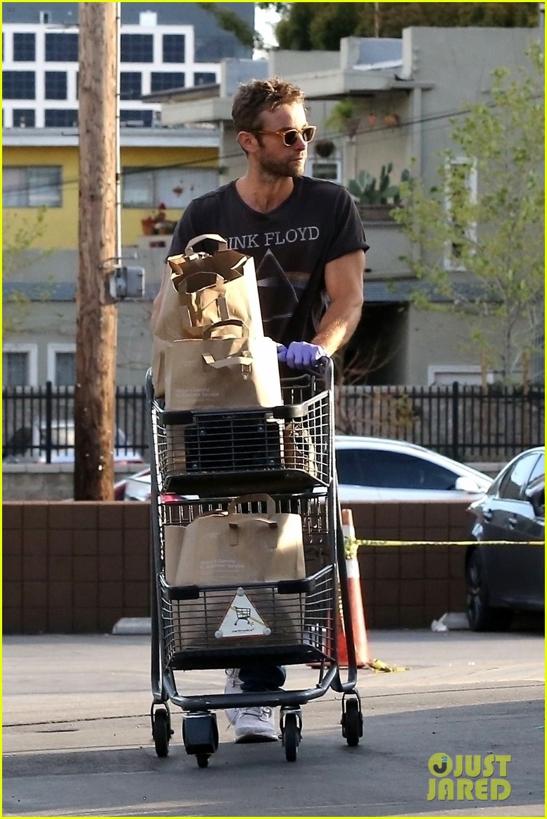 chace crawford protects himself with latex gloves at grocery store 104451290