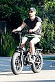 chace crawford puts muscles on display during a bike ride 04