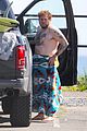 jonah hill shows off tattoos stripping out of wetsuit 01