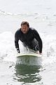 jonah hill shows off tattoos stripping out of wetsuit 02