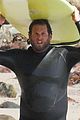 jonah hill shows off tattoos stripping out of wetsuit 06