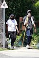 chadwick boseman walks with a walking stick 12