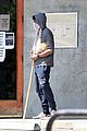 chadwick boseman walks with a walking stick 15