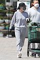 courteney cox wears face shield while shopping 01