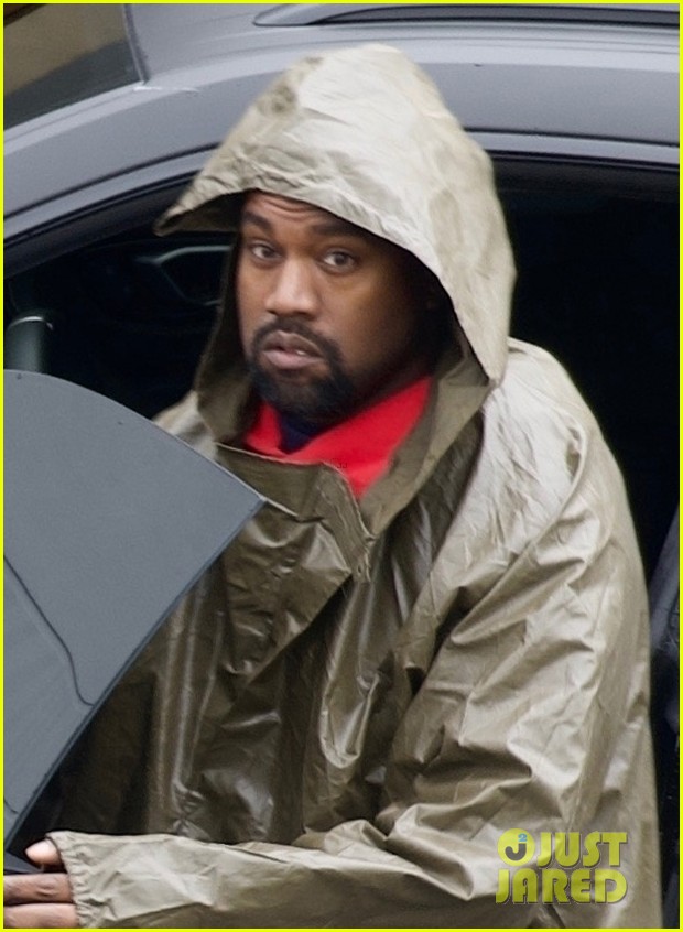 kanye west braves rainy weather while arriving at his office 02