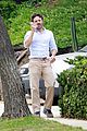 casey affleck takes call on his walk 01