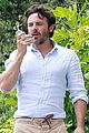 casey affleck takes call on his walk 02