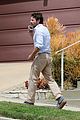 casey affleck takes call on his walk 03