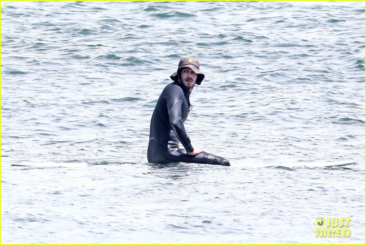 adam brody goes surfing in his wetsuit 224461592