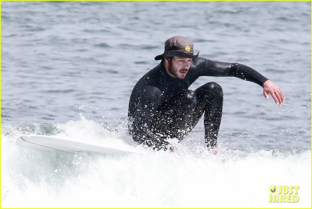adam brody goes surfing in his wetsuit 274461597