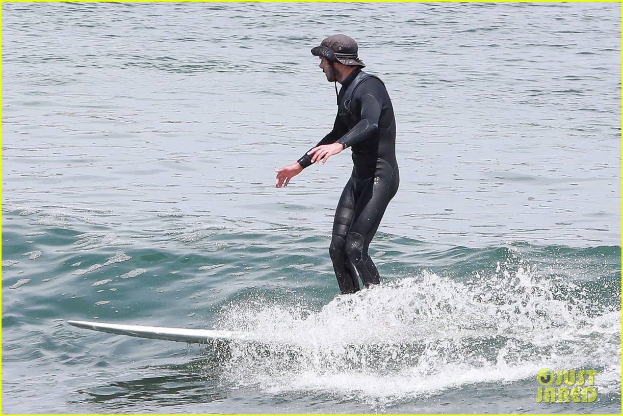 adam brody goes surfing in his wetsuit 374461607